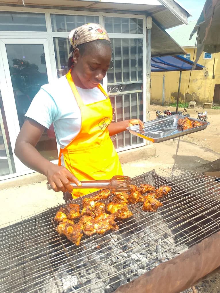 Chef grilling chicken at SpagKing